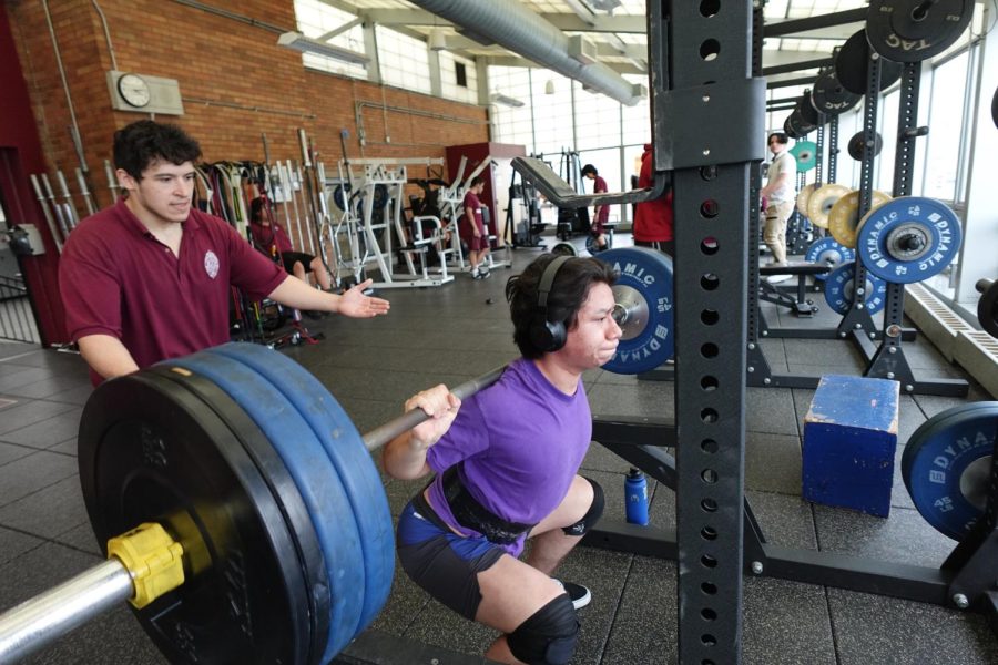 Weightlifting club leader works on his squat