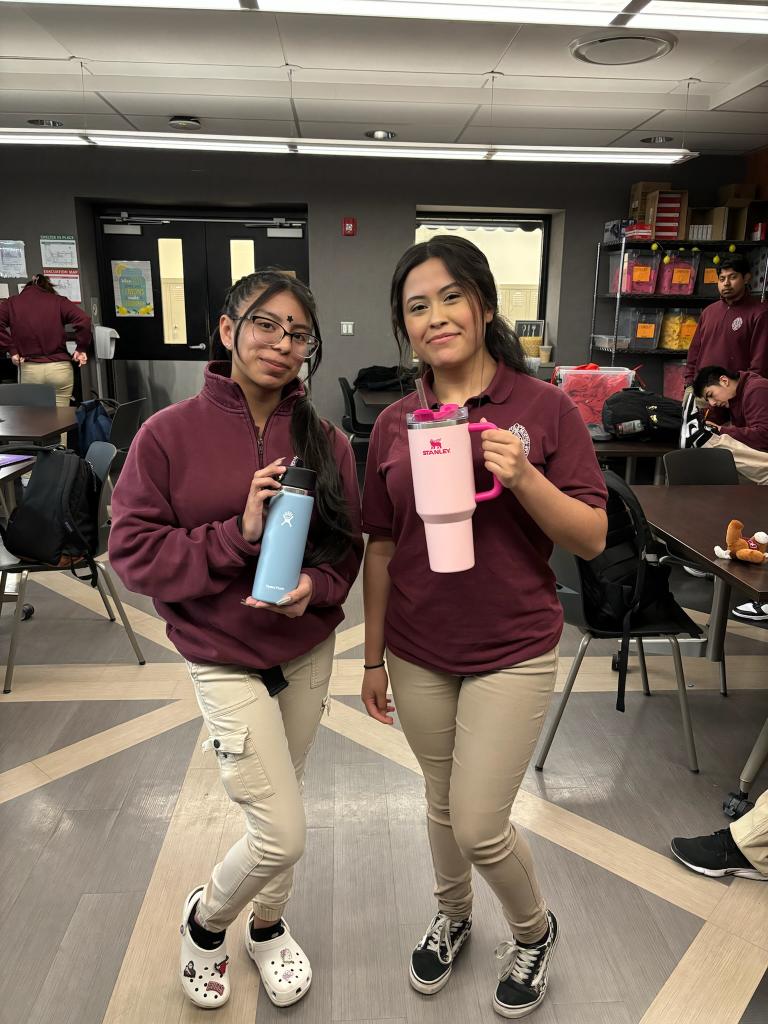 Denisse and Yareli posing with their Hydro Flask and Stanley Cup.