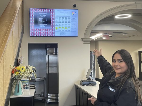 Lorena Cardenas showing the new student café located by the main staircase.