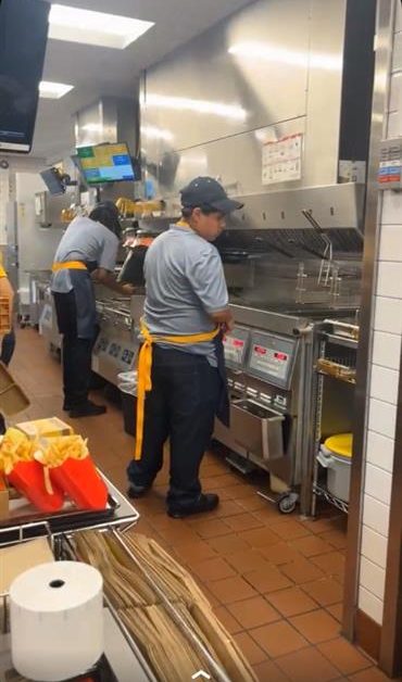 Junior Alan Gandarilla is frying fries at McDonald's.  