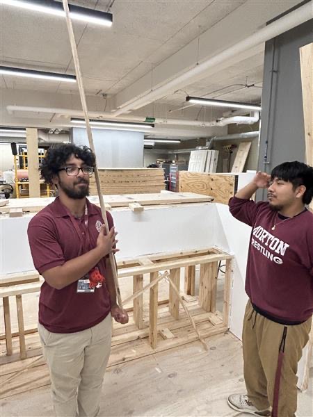 Seniors Bryan Solis and Alan Castillo work on a project together