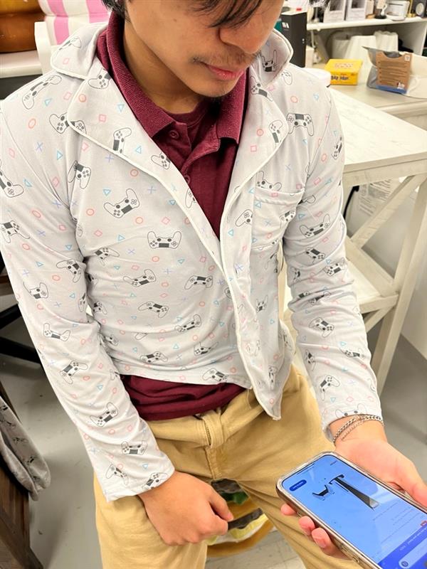 Stylish senior Andy Padilla shops for new game systems.  