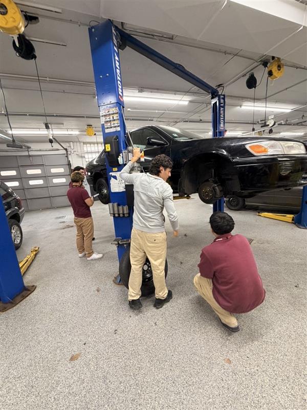 Auto mechanics students operate the Auto Shop at Morton East. 