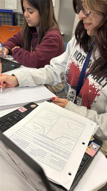 Juniors Cristel Cabral and Karla Gonzalez work together to prepare for the AP exam.